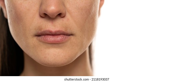 macro shot of a female face with dark skin on the upper lip