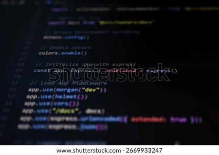 Macro shot of JavaScript backend code highlighting Express app initialization and middleware configuration for secure and structured API development.