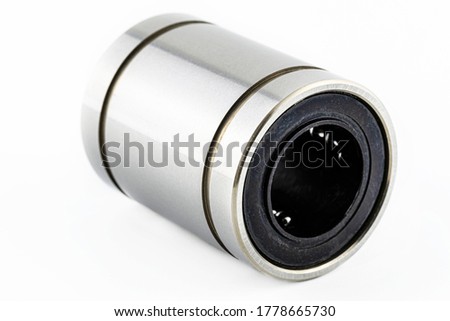 A macro shot of a linear bearing isolated on a white background.