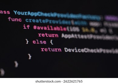 A macro shot of lines of code displayed on a screen. The syntax is highlighted with various colors against a dark backdrop, showcasing software development and programming concepts