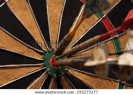 A macro shot of an old style dart board.