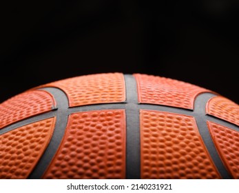 Macro Shot. On A Black Background, Details Of A Basketball. Sports, Sports Games, Healthy Lifestyle, Training, Stadium, Gym. There Is Free Space To Insert. There Are No People In The Photo.