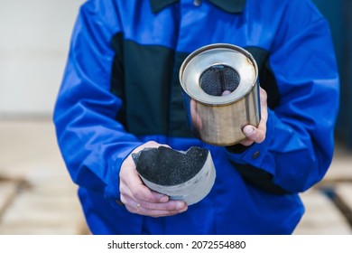 A Macro Shot Of A Piece Of Cut Metal Catalyst, Man's Hands Hold Cut Muffler Car With A Platinum Catalyst. Muffler Of The Exhaust System Of The Car 