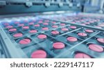 Macro Shot of Pink Pills During Production and Packing Process on Modern Pharmaceutical Factory. Medical Drug Manufacturing.