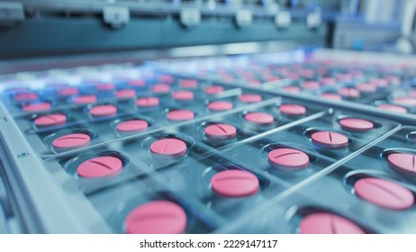 Macro Shot of Pink Pills During Production and Packing Process on Modern Pharmaceutical Factory. Medical Drug Manufacturing.