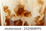 Macro Shot of Pouring Milk into Ice Coffee, Close-up