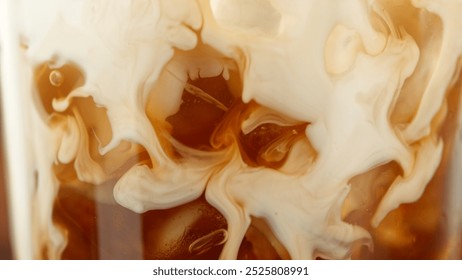 Macro Shot of Pouring Milk into Ice Coffee, Close-up - Powered by Shutterstock