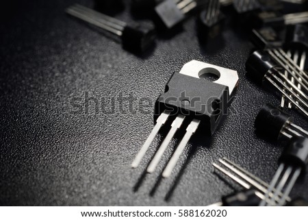 Macro shot of power transistors on the black surface
