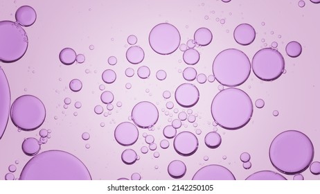 Macro shot of purple different sized transparent oil drops floating in clear liquid on light purple background | Background for skin care product