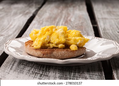 Macro Shot Of Scrambled Eggs On A Whole Wheat English Muffin