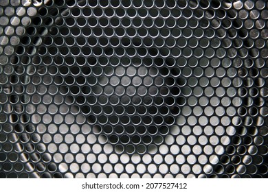 Macro Shot Of Speaker Grille. Vintage Effect. Close Up Shot Of A Round Speaker. Acoustic Broadband Speaker. Luxury Car Stereo System Speaker. Holes In A Metal Lattice.