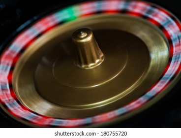 A Macro Shot Of A Spinning Toy Roulette Wheel.