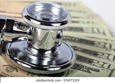 Macro Shot Of A Stethoscope On American Money.