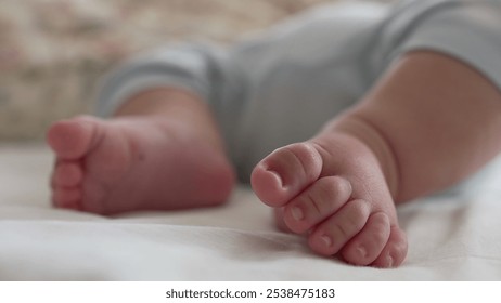 Macro shot of baby’s toes on a bed, showing fine details of the foot in a relaxed and peaceful moment of early childhood, highlighting softness and innocence - Powered by Shutterstock