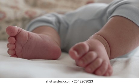 Macro shot of baby’s toes on a bed, showing fine details of the foot in a relaxed and peaceful moment of early childhood, highlighting softness and innocence - Powered by Shutterstock