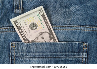 Macro Shot Of Trendy Jeans With American 5 Dollar Bill On Its Pocket