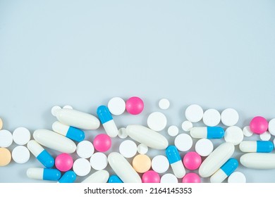 Macro shot of various colored pills on a white background, close-up health care and medical concept - Shutterstock ID 2164145353