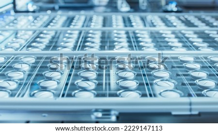 Macro Shot of White Pills During Production and Packing Process on Modern Pharmaceutical Factory. Medical Drug Manufacturing.