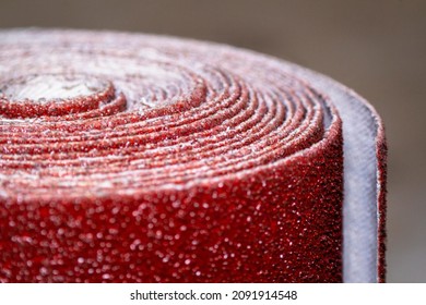 Macro shots a roll red colour belt sander sandpaper - Powered by Shutterstock