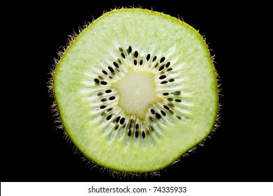 Macro Of Slim Sliced Kiwi Fruit On Black Background