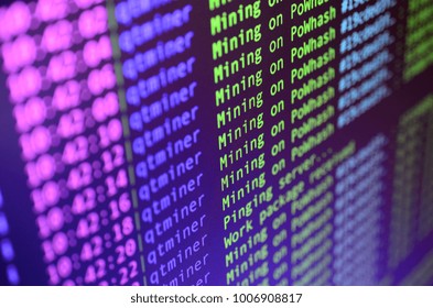 Macro snapshot of the program interface for crypto currency mining on the monitor of an office computer. The concept of mining bitcoins. The flow of information strings and data