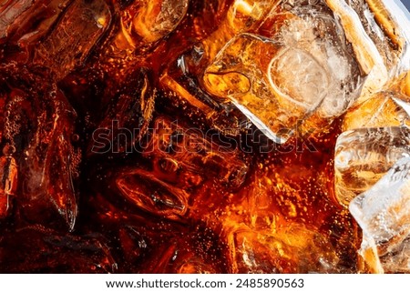Macro soft drink and ice drink texture,Cola and ice cubes macro texture. Cola drink with ice closeup background.
