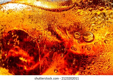 macro soft drink,Glass of tasty refreshing cola with ice cubes on black background, closeup,Cola close-up - Shutterstock ID 2123202011