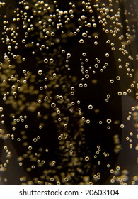 Macro Of Sparkling Champagne Against Black Background