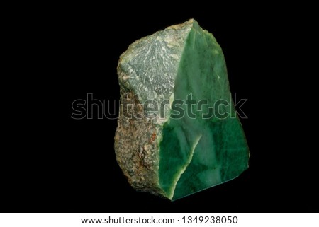 Macro stone Nephrite mineral on black background close up