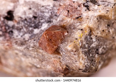 Macro stone Zircon mineral on white background close up
