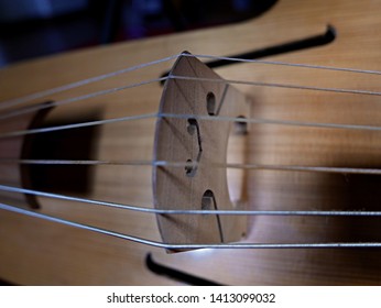 macro of strings and bridge of the viola da gamba - Shutterstock ID 1413099032