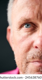 Macro Studio Expression Shot Of Senior Man's Eyes With Close Up On Eyelashes And Pupil