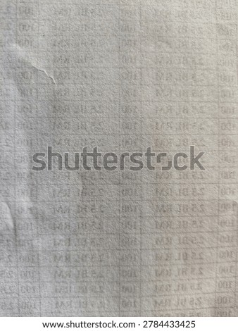 Macro texture of blurred white receipt paper with a grid line pattern