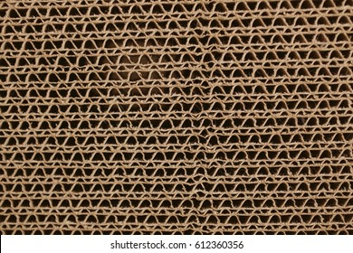 Macro texture of cardboard. Cardboard corrugated pattern. Abstract texture and background for designers. Brown paper texture and pattern. Closeup view of cardboard background.  