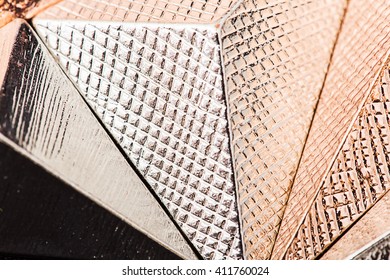 Macro texture of metallic pyramid in studio