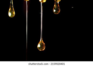 Macro Texture Of Oil Droplet On Black Background