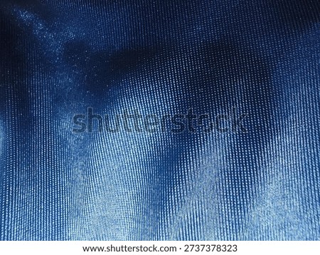 Macro texture of premium navy blue marled knit fabric. This high-resolution textile background features a detailed indigo heathered weave with soft woolen fibers and a subtle distressed aesthetic. Perfect for professional backgrounds, fashion apparel mockups, winter lifestyle designs, and industrial textile surfaces