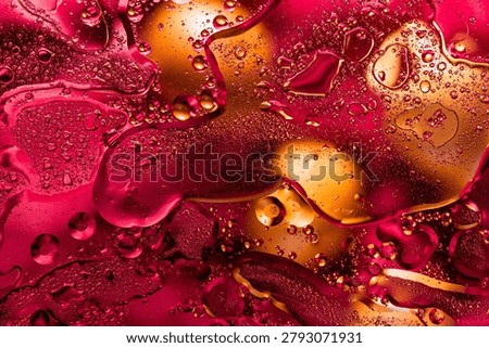Macro texture of red hot fluid with gold highlights
