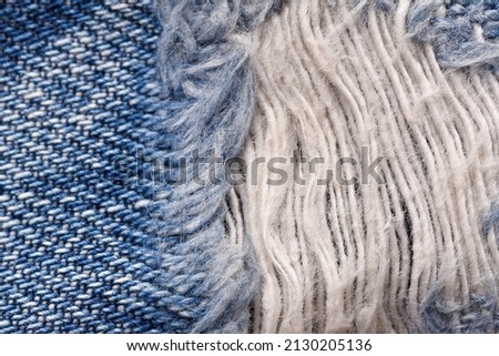 Macro of torn jeans, Denim texture pattern, Close up of ripped threads, Fabric detail background.