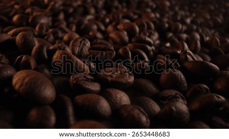 Macro View Of Aromatic Roasted Coffee Beans. Natural textured surface. Rich aroma, caffeine concept. Morning energy. Fresh organic seeds. Brazilian arabica harvest. High quality 