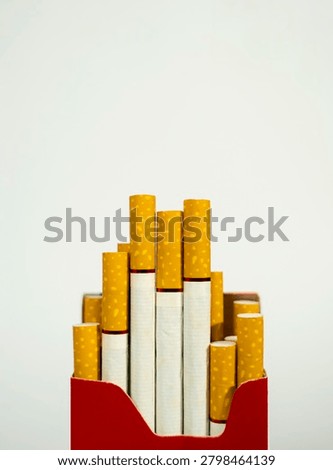Macro view of cigarette pack with visible yellow filters cigarette addiction nicotine unhealthy abstinence lifestyle