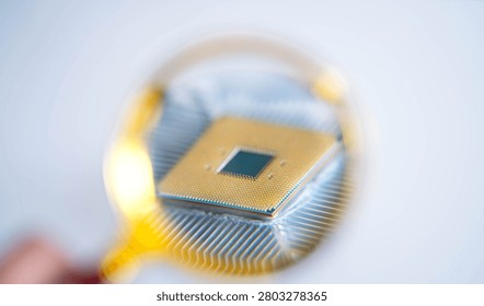 Macro view of computer processor through magnifying glass showing semiconductor chip, CPU architecture and microelectronics. Concept of artificial intelligence, hardware inspection and digital technology.