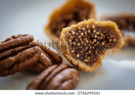 Macro view of dried figs and pecans with shallow depth of field