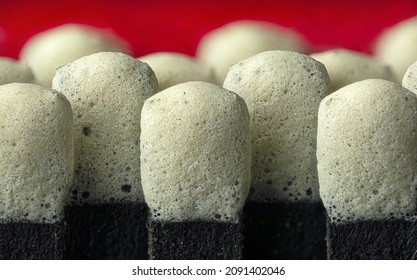 Macro View Of Heads Of Matches In A Red Matchbook.