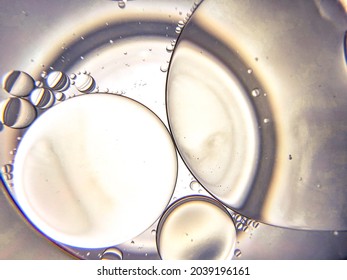 A macro view of oil and water in a glass. Location: Selangor, Malaysia. Date: September 10, 2021.