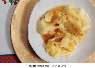 Macro View On Yellow Big Tortelloni, Traditional Italian Stuffed Pasta, Combined With Meat Sauce. Homemade Dish. Christmas Lunch Recipe. 