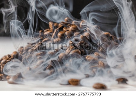 Macro view of roasted coffee beans with dense, flowing steam drifting across the frame, highlighting texture and warmth against a dark background with subtle copy space