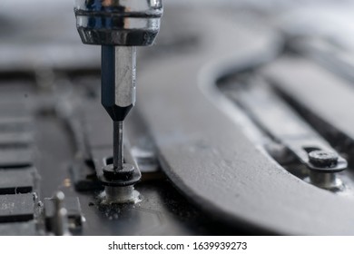 macro view small screwdriver screw and repair the detail inside the computer - Shutterstock ID 1639939273