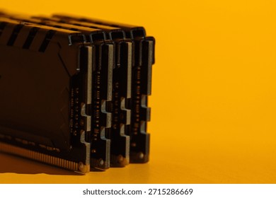 Macro view of stacked RAM module ends on yellow background