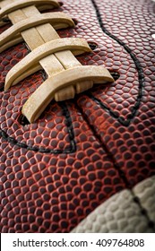 Macro Of A Vintage Worn American Football Ball With Visible Laces, Stitches And Pigskin Pattern